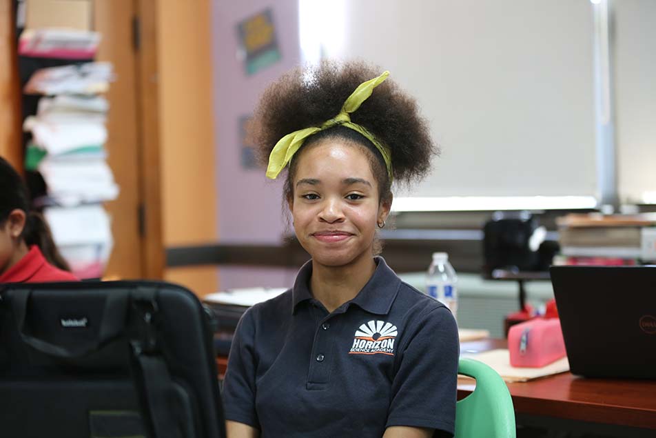 students and teacher working in classroom
